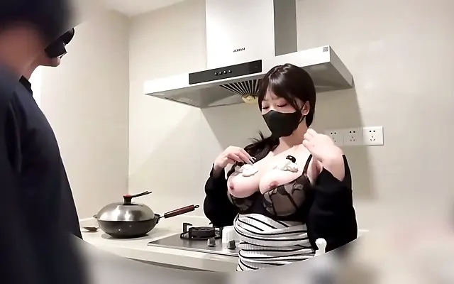 Cooking up heat in the living room she seduces with creamy temptation