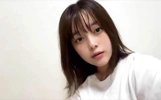Dim room amateur Japanese coed invites you to watch her explore her wet pussy