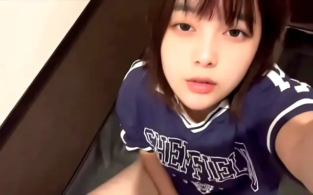 Wife jerks off at net cafe desk while reading dirty manga and fantasizing about cock